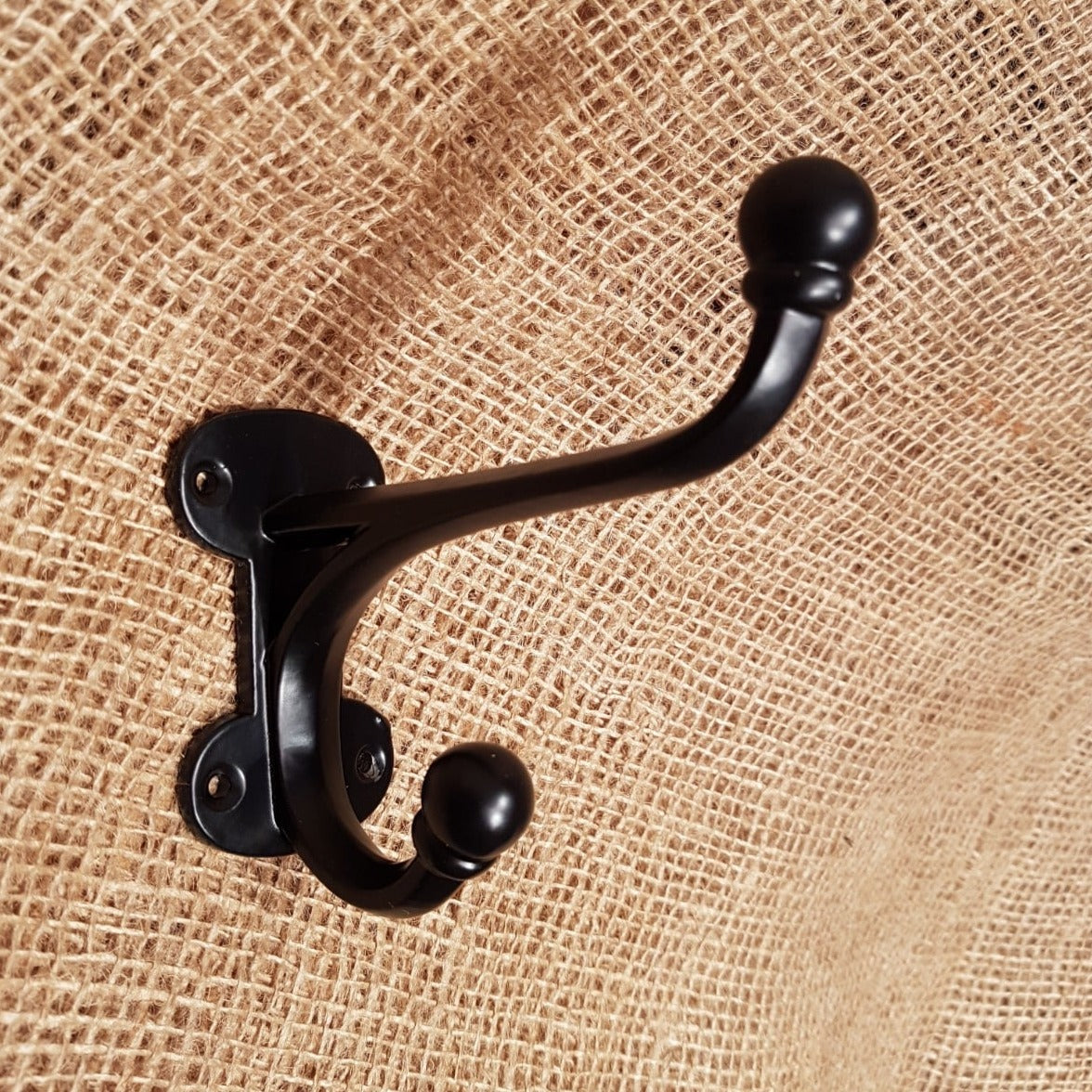 http://www.thespearheadcollection.com/cdn/shop/products/hall-stand-vintage-hat-coat-hook-black-coated1-min.jpg?v=1647361067